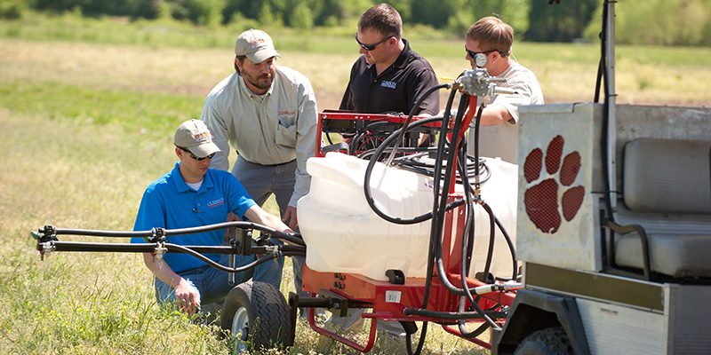 photos of Ag Mech and Biz students who have taken a 4-seater golf cart, removed the electric motor and added a diesel engine and a hydrostatic transmission (like a tractor). Additionally, they have added a PTO (power take off) to the rear of the golf cart to power a water pump for a sprayer. This is going to be used to teach several Ag Mech and Business classes, since the instructor can have 3 students ride along as the new technology is being learned, as opposed to a tractor where only one operator can ride.