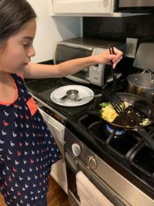 Cooking Like a Chef participant learns to make an omelet. 