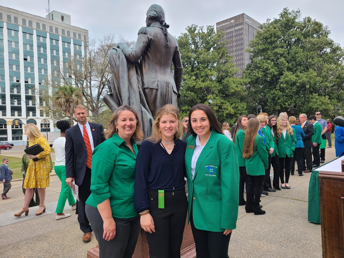 Adult and Teens in front of SC State Capital House