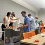 Students line up at a Beta Alpha Psi Meeting to fill Welcome Back boxes for faculty