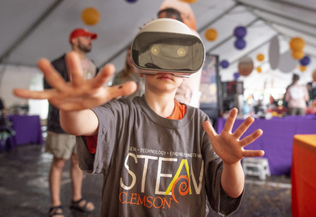 Children explore Clemson's STEAM Exhibit at Artisphere.