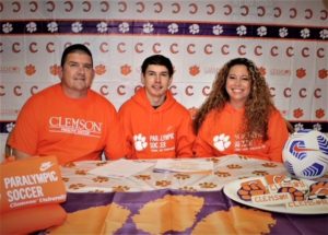 Kevin McCandlish signs his intent to join Clemson's Paralympic soccer residential training program. 