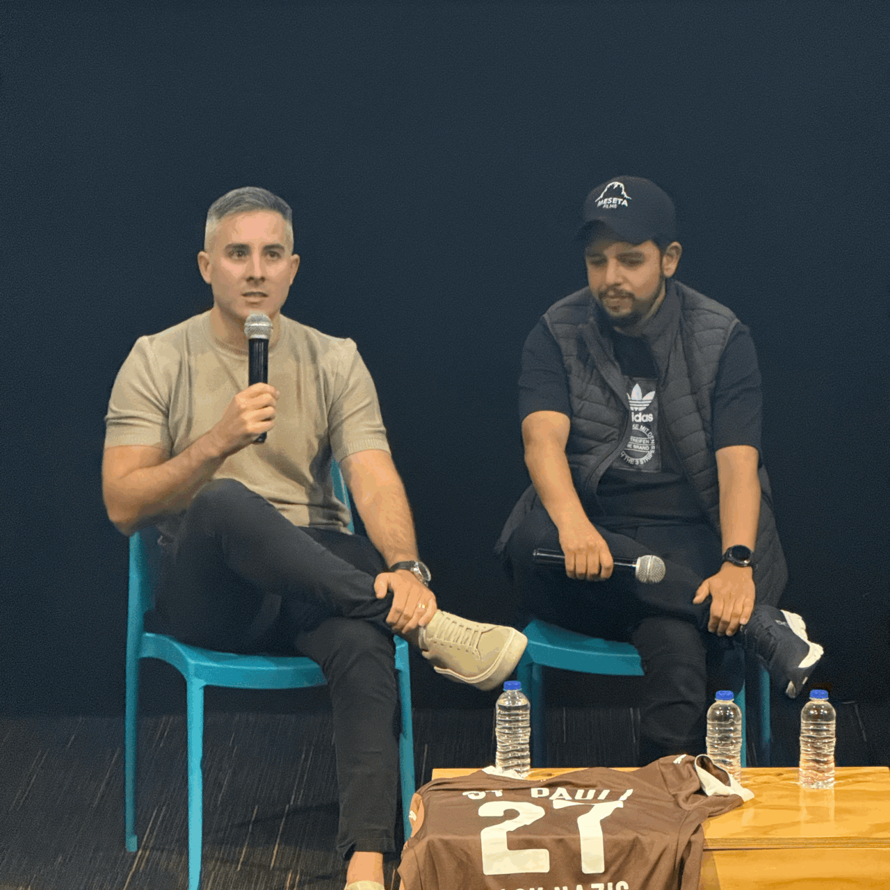 Tobar and colleague speaking on their documentary in Colombia