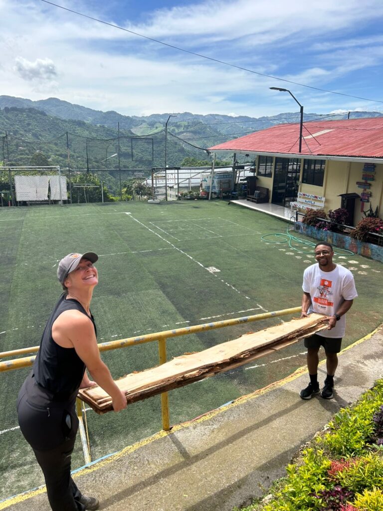 Ashlyn Hardie and Mike Clark participating in service work