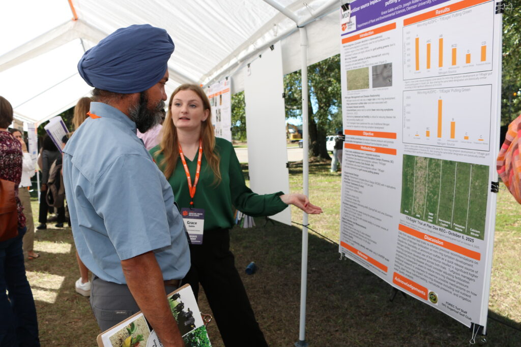 Students present posters related to their research.