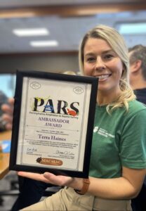 Terra Haines holding her award