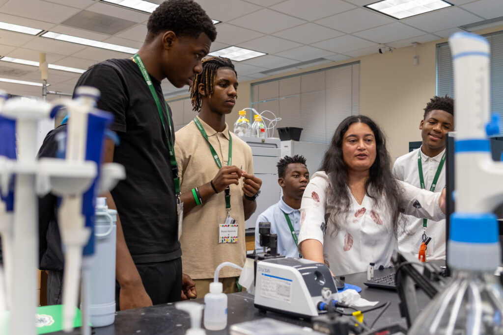 The students learn about how different lab equipment is used to breed pulse crops.