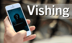 Close up image of hand holding a phone showing a picture of someone in a hoodie with a question mark on their face with the caption 'Vishing'.