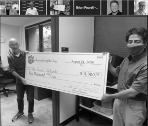 Vincent Richards, left, accepts a check as junior faculty Researcher of the Year during a virtual awards ceremony. 