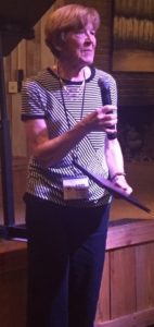 Older woman talking in microphone