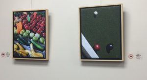 Two framed photographs on left is fruit stand and on right bocci balls