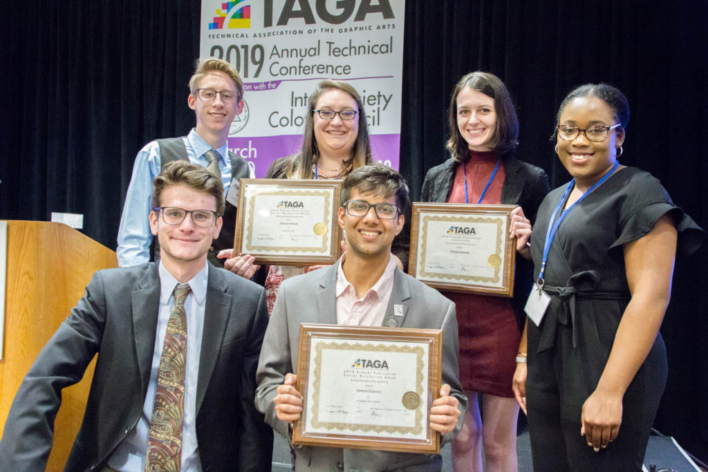 ClemsonGC students proudly display TAGA awards earned for the production of their journal this year.