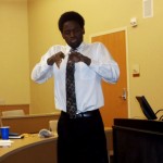 Photo of senior Lawrence Reed who interprets the dialogue between speakers and audience at the American Sign Language Club’s Spring Seminar