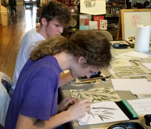 photo of students practicing calligraphy