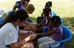 Clemson students on the Creative Inquiry team of Moore de Peralta work with local children in Las Malvinas, Dominican Republic.