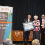 Professor emeritus Pat Wannamaker (center) is inducted at the CAAH Hall of Fame Ceremony. Presenting her with the award are CAAH Dean Richard Goodstein (left) and Chair of the Department of Languages Salvador Oropesa (right). Photo courtesy of Clemson University.