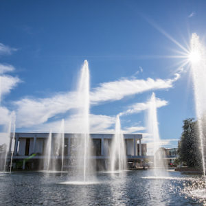 The Cooper Library fountains shoot up into the sun on a clear day.