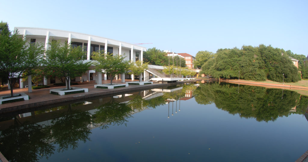 The Reflection Pool with library on left and Rhodes in center.