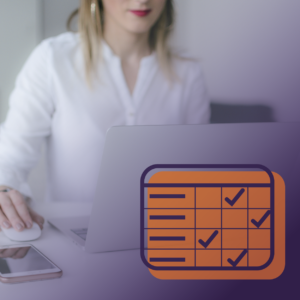 Woman working on a computer, with rubric icon in the bottom right corner.