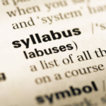 close up of the definition of syllabus in dictionary