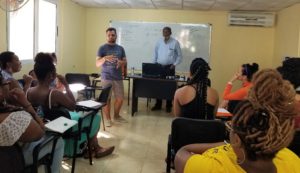 Students learn about Cuba’s economy and Afro-Cuban heritage from a guest speaker at the Center for José Martí Studies in Havana.