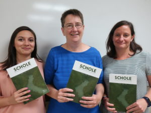 (L to R): Drs. Mariela Fernandez, Gwynn Powell and Lauren Duffy with their copies of the SCHOLE special issue. 