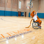Clemson Tiger playing wheelchair basketball in Fike Recreation Center.