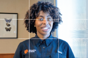 smiling female with grid lines displaying the rule of thirds