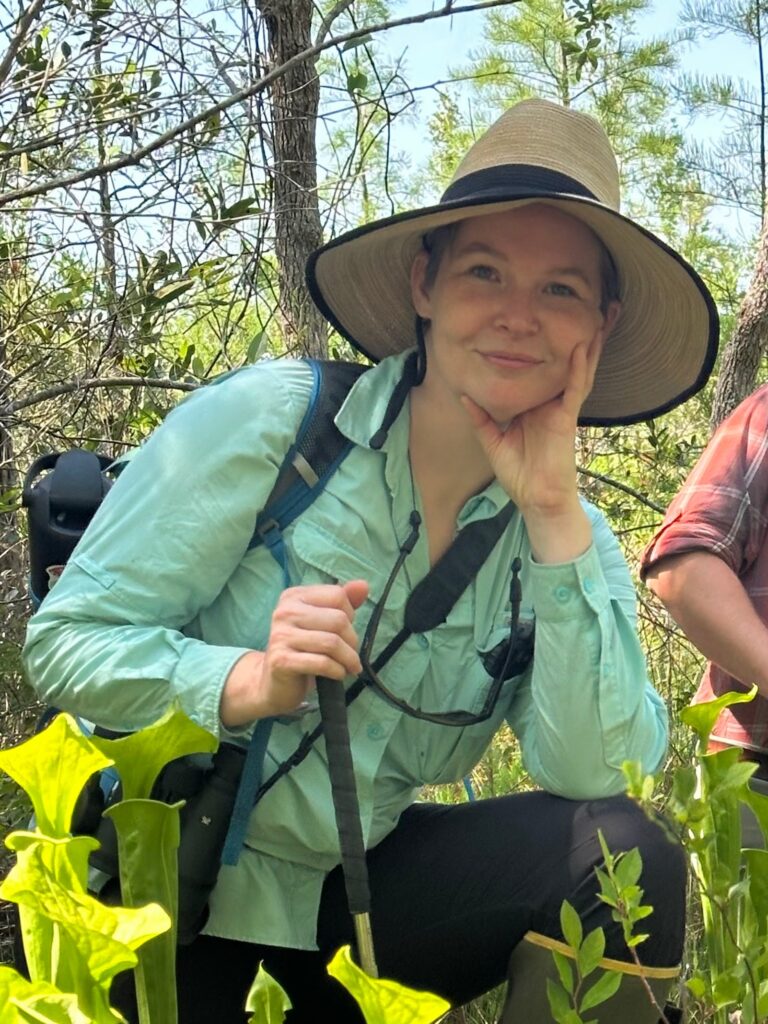 Image of the author Tess Moody in a wetland