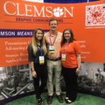 Students pose in the Clemson booth at the FTA Forum