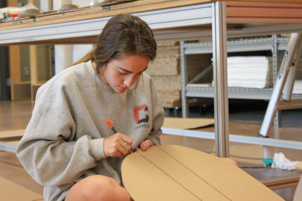 Student working with corrugated fiberboard