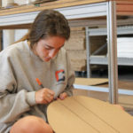 Student working with corrugated fiberboard