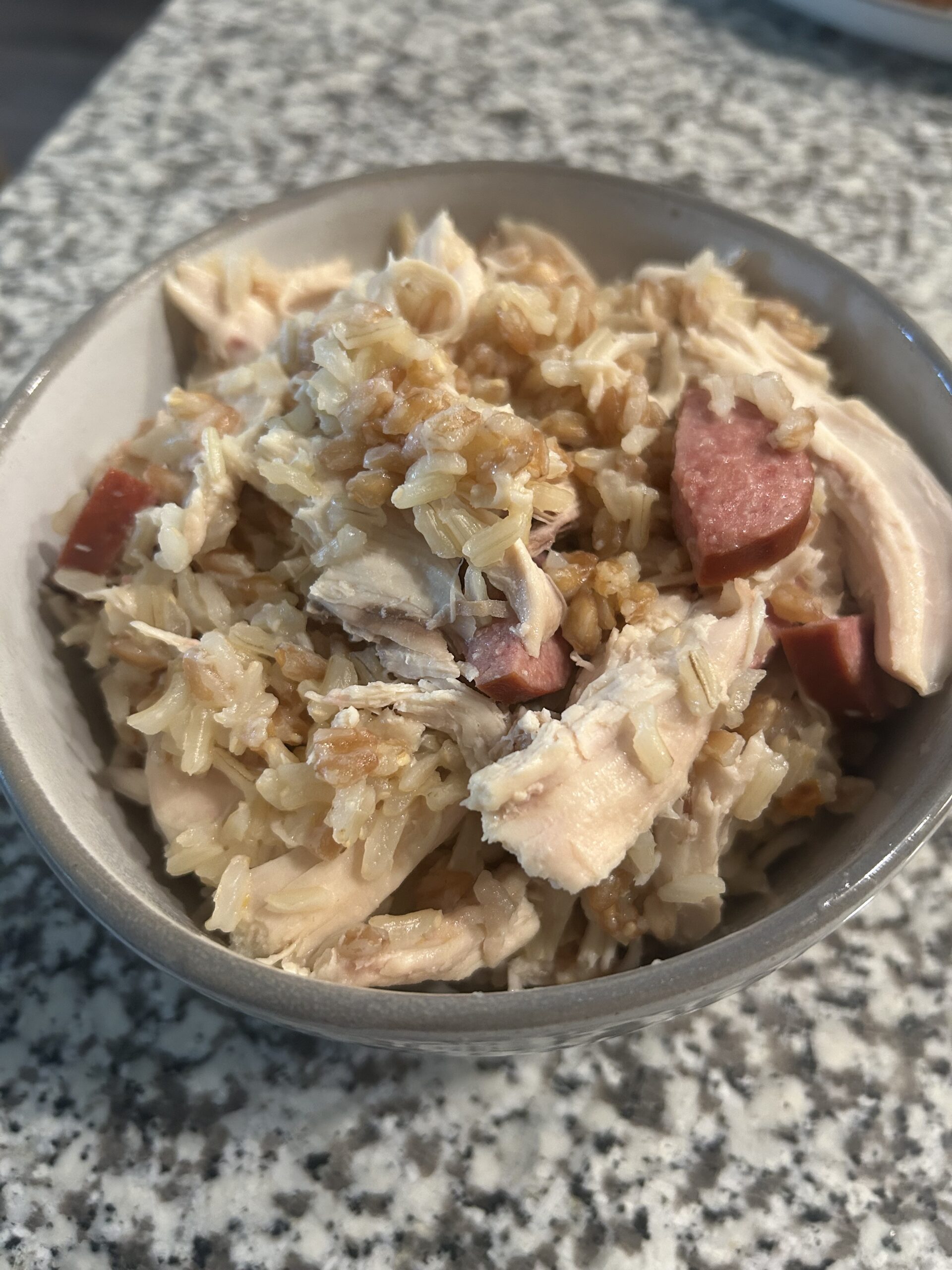 Whole grain chicken bog made with brown rice and farro along with turkey smoked sausage and pulled chicken breast