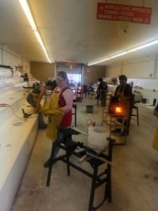 forging students working