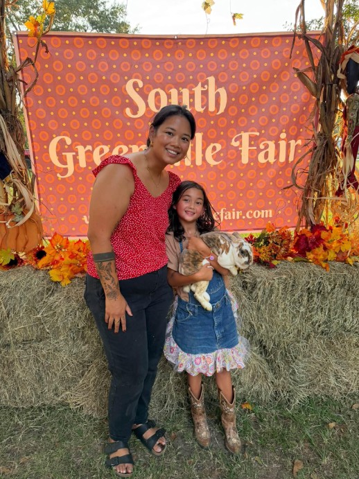 Amie Mabe and 4-H holding a rabbit