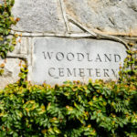 Stone entrance sign for Woodland Cemetery