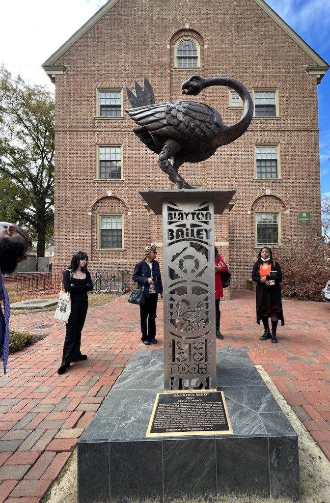 The "Sankofa Seed" statue created by Steve Prince to honor the first three African American students in residence at William and Mary.